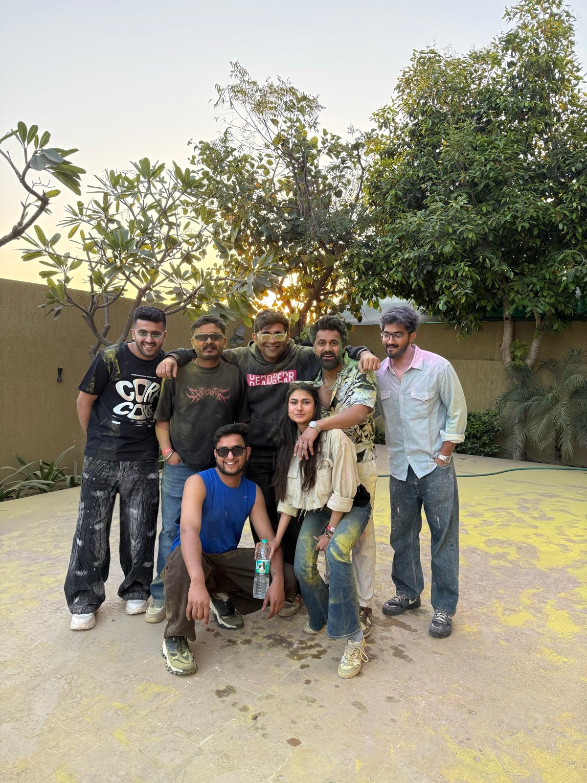 Friends posing together after a colourful festival day
