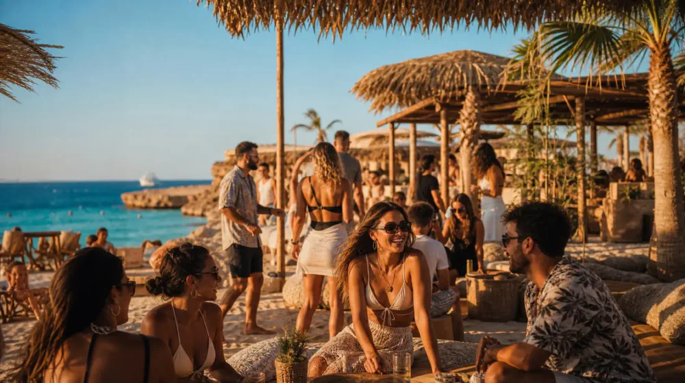 Beach club gathering beside blue water